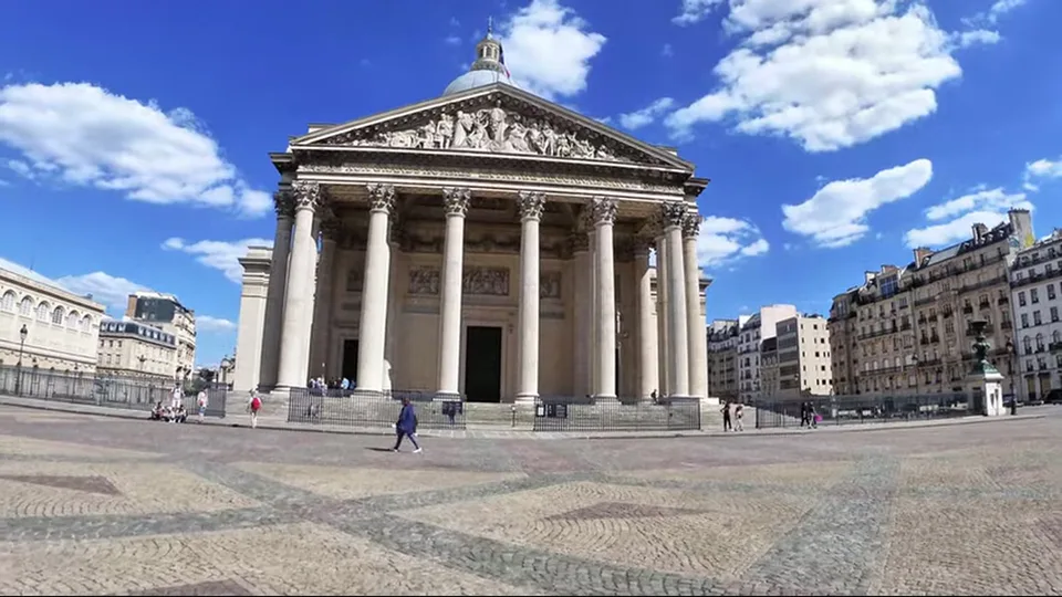 Frontal view of the Pantheon facade and dome on a bright day in Paris