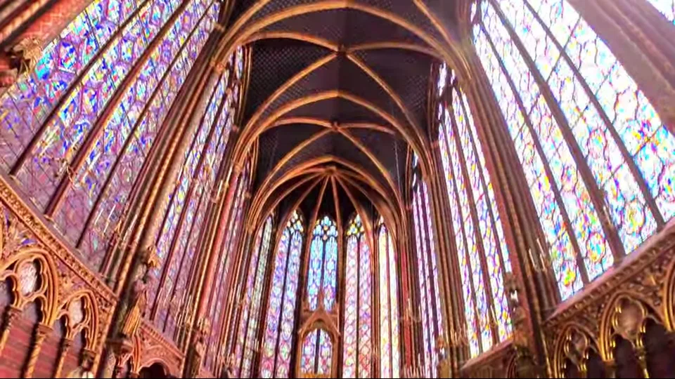 Wide view of Sainte-Chapelle upper chapel with stained glass and vaulted ceiling