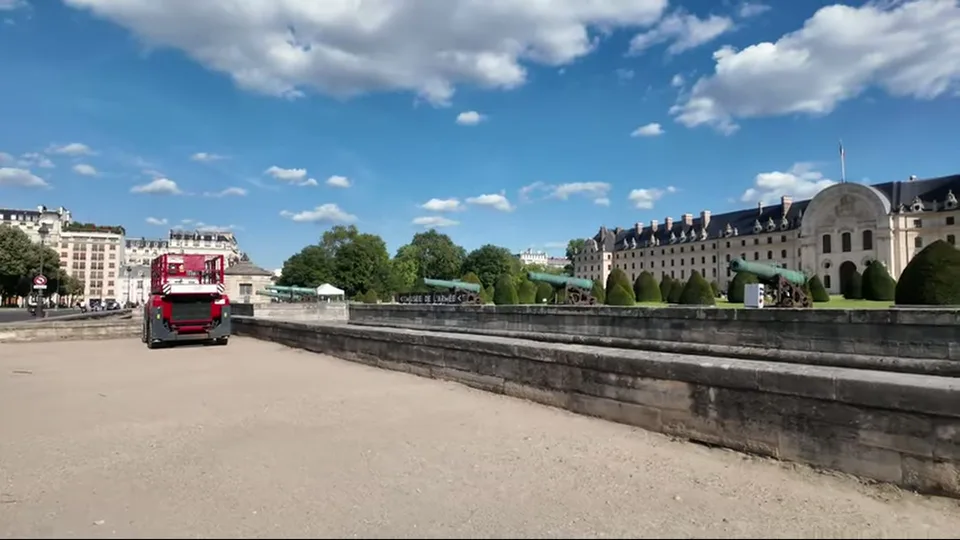 Clear frontal view of Hotel des Invalides with its gold dome and entrance gate
