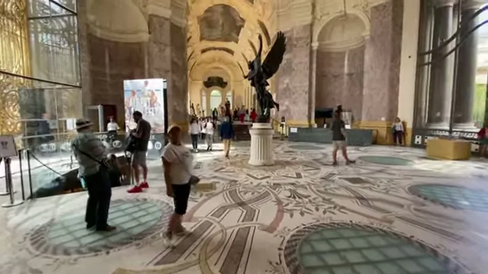 Sculpture gallery at Petit Palais with central statue and painted ceiling